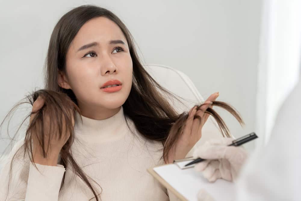 Woman consulting with a specialist about hair loss due to Ozempic and next steps forward.