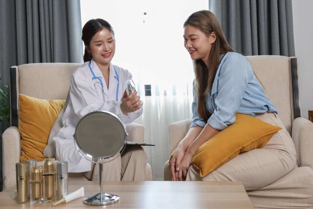 A healthcare professional consulting her patient about stem cell face treatments in Bangkok.